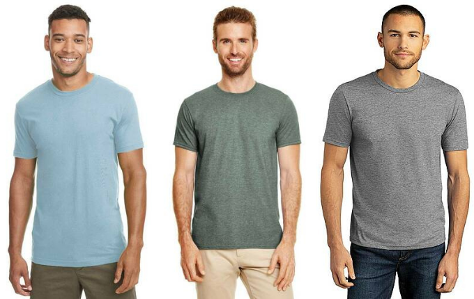 A man modeling the Next Level 3600 crewneck t-shirt in “stonewash blue”, a man modeling the Gildan G640 crewneck tshirt in “heather green”, and a man modeling the Distirict DM130DTG tee shirt in “gray frost”.