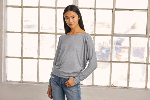 Woman modeling grey long sleeve bella+canvas t-shirt