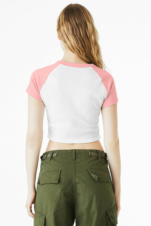 Front view of a woman wearing a Bella+Canvas crop top baby tee raglan, paired with olive green cargo pants for a color-blocked outfit.