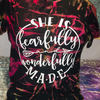 Reverse tie dye t shirt that reads she is fearfully wonderfully made by April Tees and Creations