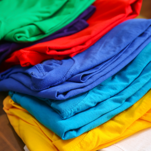 A stack of colorful cotton shirts.