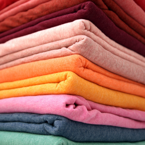 Colorful stack of brushed cotton blank apparel.