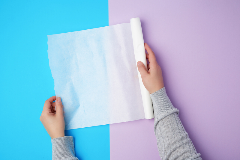 Cover the transfer paper using the paper backing, or use a soft kitchen towel.