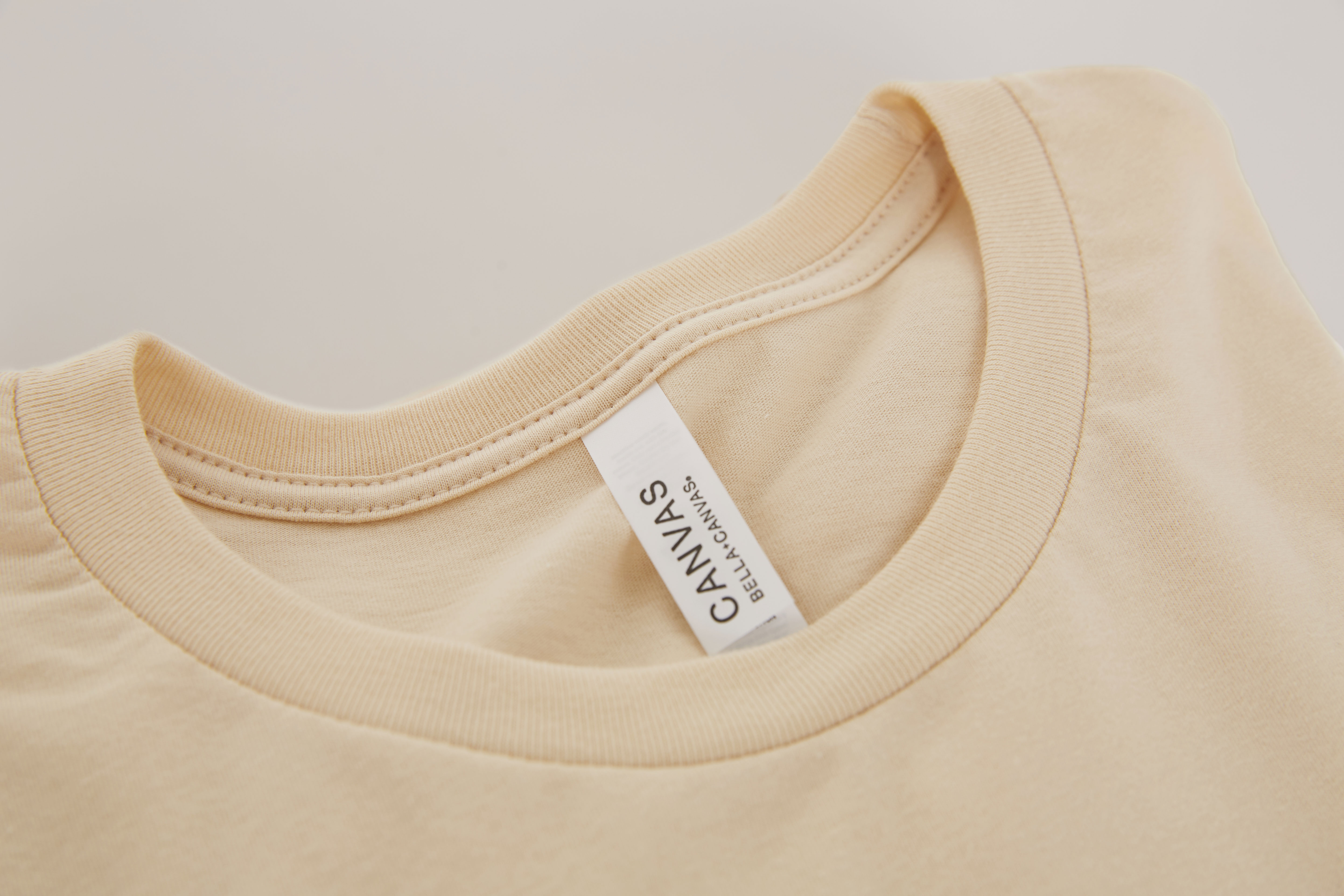 Bella+Canvas 3001C Unisex Jersey Short Sleeve Crewneck T-Shirt from ShirtSpace pictured in the color soft cream.
