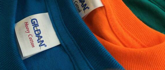 Blue, orange and green Gildan Heavy Cotton t-shirt necklines and tags.