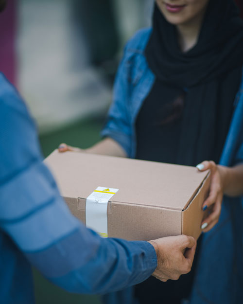 A person receiving a package delivery.