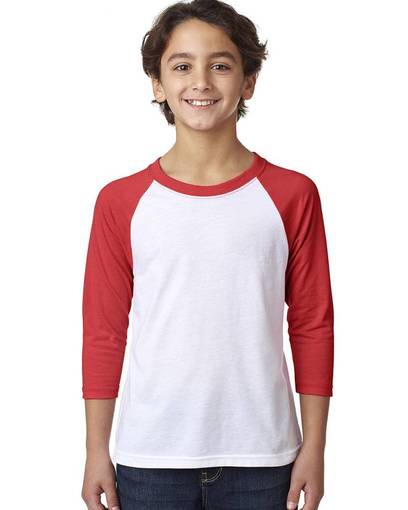 A kid wearing the Next Level 3352 white and red raglan tee.