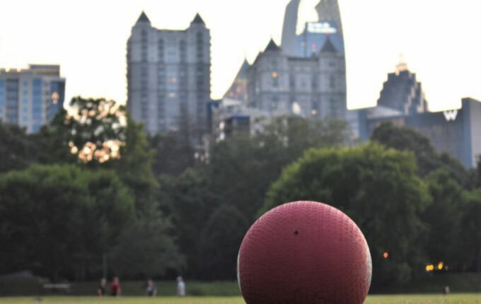 kick-ball-on-grass-with-building-in-background-shirtspace.jpg