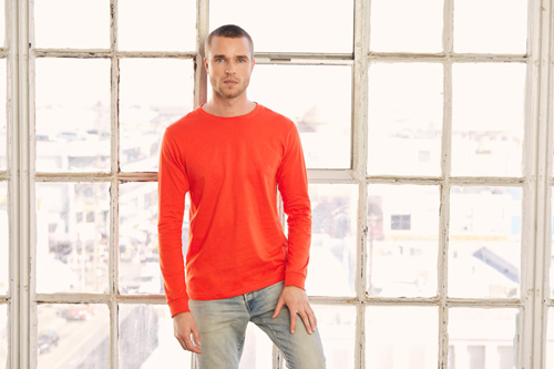 Man modeling orange long sleeve bella+canvas t-shirt