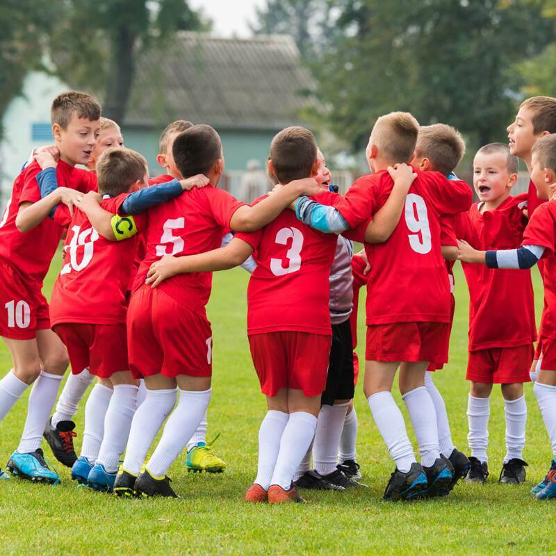 Kids in a huddle during a soccer game