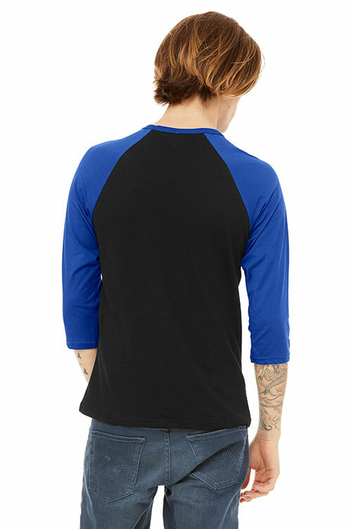 Back view of a man wearing the Bella+Canvas 3200 raglan tee in “Black/True Royal” for the perfect color-blocked outfit. 