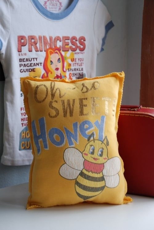 Yellow pillow with honey bee
