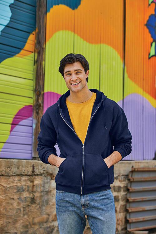  Man wearing a mustard yellow t-shirt with a zip-up navy blue Fruit of the Loom sweatshirt.