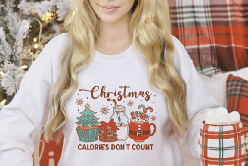 Woman wearing a retro Christmas print that features illustrations of tasty holiday goodies. 