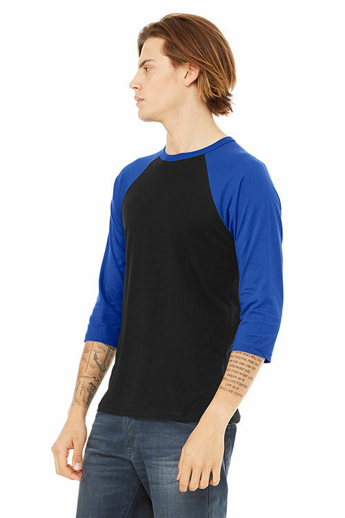 Side view of a man wearing the Bella+Canvas 3200 raglan tee in “Black/True Royal” for the perfect color-blocked outfit. 