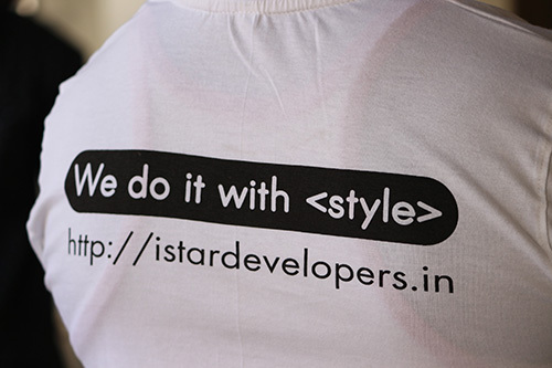 Plain white t-shirt with black print for a developer company. 