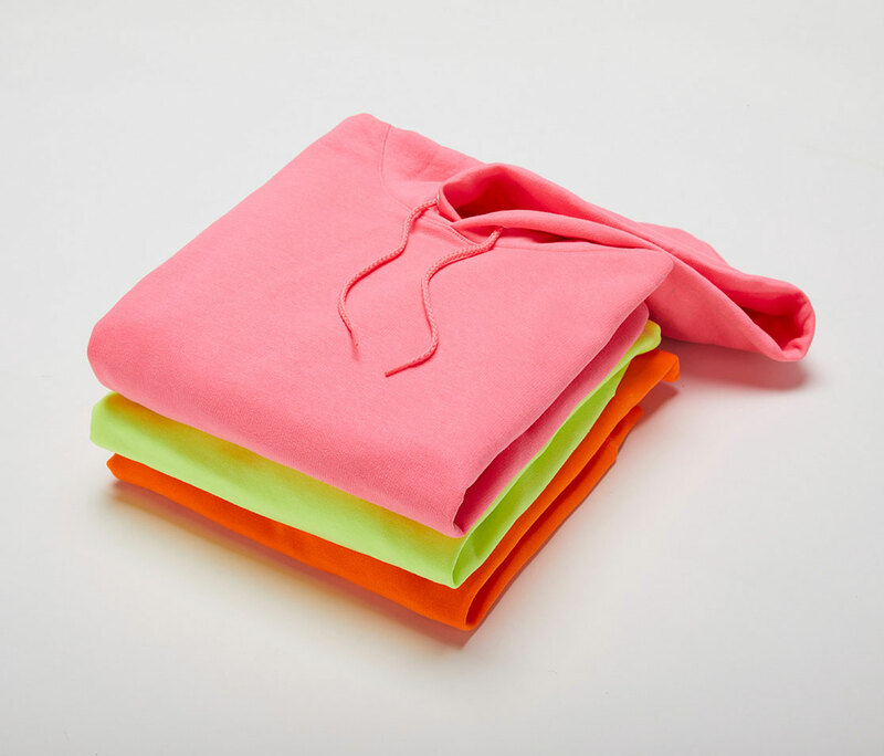 Folded and stacked Hanes P170 hoodies in safety colors from ShirtSpace.