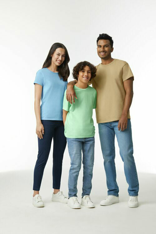 Family wearing the Gildan G200 collection of t-shirts, including the adult unisex G200 in the color tan, the ladies’ G200L in light blue, and the kids’ G200B in mint green.