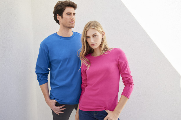 Man modeling the Gildan G540 Adult Heavy Cotton™ 5.3 oz. Long-Sleeve T-Shirt in the color royal and woman modeling the Gildan G540L Ladies' Heavy Cotton™ 5.3 oz. Long-Sleeve T-Shirt in the color heliconia.