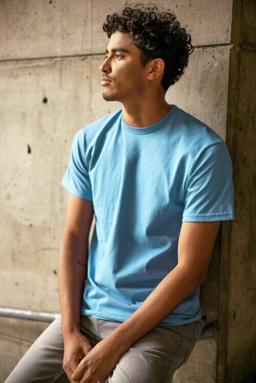 Man modeling the Anvil by Gildan 980 unisex tee in the color light blue. 