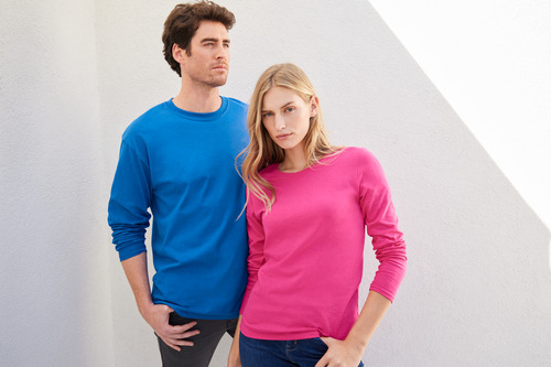 Man and woman modeling the Gildan G540 Long Sleeve T-shirt and the Gildan G540L Women’s Long Sleeve Tee Shirt. The man wears the G540 in “Royal” and the woman is wearing the G540L in “Heliconia’. 