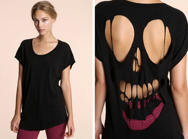 Front and back views of a woman wearing a black scoop-neck t-shirt with a skull design cut out the back.