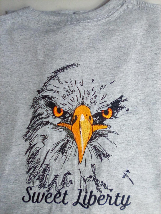 Grey heathered t-shirt embroidered with bald eagle image and the words sweet liberty